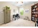 Home office space with a desk, office chair, ceiling fan, bookcase and bright window with great natural light at 468 Papyrus Circle # 468, Little River, SC 29566