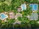 Aerial view of community amenities, including pools, tennis courts, and lush landscaping at 4744 Bucks Bluff Dr., North Myrtle Beach, SC 29582