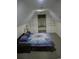 Attic bedroom featuring built-in shelving and a dormer window, with a comfortable seating area at 4744 Bucks Bluff Dr., North Myrtle Beach, SC 29582