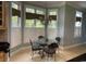 Bright dining area features a chandelier, and large windows with stylish striped valances and white shutters at 4744 Bucks Bluff Dr., North Myrtle Beach, SC 29582