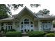 Stunning home featuring a large arch window and inviting outdoor seating area at 4744 Bucks Bluff Dr., North Myrtle Beach, SC 29582