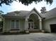 Charming single-story home with a covered front porch and mature landscaping at 4744 Bucks Bluff Dr., North Myrtle Beach, SC 29582
