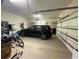 Spacious two car garage with an automatic garage door, a car, and lots of storage space at 4744 Bucks Bluff Dr., North Myrtle Beach, SC 29582