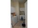Functional laundry room equipped with a washer, dryer, utility sink and ample storage space at 4744 Bucks Bluff Dr., North Myrtle Beach, SC 29582