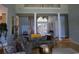 Bright living room with high ceilings, hardwood floors, grand staircase, and an elegant chandelier at 4744 Bucks Bluff Dr., North Myrtle Beach, SC 29582