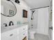 Bright bathroom with a white vanity, modern black fixtures, and a shower/tub combo at 485 Waterford Dr., Georgetown, SC 29440