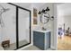 Modern bathroom with black fixtures, including a rainfall shower, and a marble countertop at 485 Waterford Dr., Georgetown, SC 29440