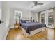Cozy bedroom with hardwood floors, a ceiling fan, and a door to the patio at 485 Waterford Dr., Georgetown, SC 29440