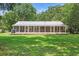 Charming ranch-style home with a metal roof and a spacious screened-in porch at 485 Waterford Dr., Georgetown, SC 29440