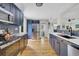 Modern kitchen features stainless steel appliances, blue cabinetry, and hardwood floors at 485 Waterford Dr., Georgetown, SC 29440
