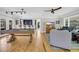 Spacious living room with a pool table, bar seating, and hardwood floors at 485 Waterford Dr., Georgetown, SC 29440