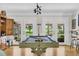 Pool table in an open concept living room with a bar top and access to the backyard through french doors at 485 Waterford Dr., Georgetown, SC 29440
