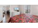 Bedroom featuring a queen-sized bed and an open view to the living and dining areas at 4872 Dahlia Ct. # 305, Myrtle Beach, SC 29577
