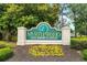 Charming Myrtlewood Golf Resort entrance sign adorned with colorful flowers at 4872 Dahlia Ct. # 305, Myrtle Beach, SC 29577