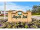 Magnolia North entrance sign surrounded by lush landscaping with colorful flowers at 4872 Dahlia Ct. # 305, Myrtle Beach, SC 29577