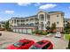 Spacious condo building featuring multiple floors, private garage, and ample parking space at 4872 Dahlia Ct. # 305, Myrtle Beach, SC 29577