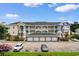 Attractive condo building featuring private garages and ample parking, Unit #305 at 4872 Dahlia Ct. # 305, Myrtle Beach, SC 29577
