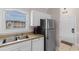 Kitchen featuring stainless steel appliances, white cabinets and a double sink at 4872 Dahlia Ct. # 305, Myrtle Beach, SC 29577