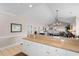 Open kitchen featuring stainless steel appliances and a breakfast bar leading to the living area at 4872 Dahlia Ct. # 305, Myrtle Beach, SC 29577