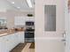 Cozy kitchen with white cabinets and stainless steel appliances at 4872 Dahlia Ct. # 305, Myrtle Beach, SC 29577