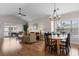 Open-concept living room featuring vaulted ceilings, hardwood floors, and sliding door to balcony at 4872 Dahlia Ct. # 305, Myrtle Beach, SC 29577