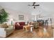 Open-concept living area with hardwood floors, dining area, and views of the kitchen at 4872 Dahlia Ct. # 305, Myrtle Beach, SC 29577