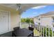 Covered balcony with a ceiling fan and outdoor dining table and a view of the community at 4872 Dahlia Ct. # 305, Myrtle Beach, SC 29577