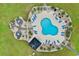 Aerial view of community pool featuring sun loungers, landscaping, and gazebo area at 4872 Dahlia Ct. # 305, Myrtle Beach, SC 29577