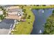 Aerial view of a house next to a pond with a fountain at 492 Grand Cypress Way, Murrells Inlet, SC 29576