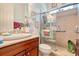Bathroom featuring a glass enclosed shower with tiled walls and built-in shelving at 492 Grand Cypress Way, Murrells Inlet, SC 29576