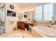 A luxurious bathroom with double vanities, makeup vanity, and a corner soaking tub at 492 Grand Cypress Way, Murrells Inlet, SC 29576