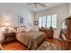 A comfortable bedroom featuring wood floors and a striking leopard print comforter at 492 Grand Cypress Way, Murrells Inlet, SC 29576