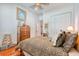 A comfortable bedroom featuring wood floors and a striking leopard print comforter at 492 Grand Cypress Way, Murrells Inlet, SC 29576