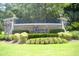Beautiful stone community entrance sign at Seasons at Prince Creek West with manicured landscaping at 492 Grand Cypress Way, Murrells Inlet, SC 29576