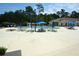 Large community swimming pool with plenty of lounge chairs and umbrellas at 492 Grand Cypress Way, Murrells Inlet, SC 29576