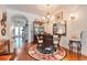 Cozy dining area with a round table, elegant chandelier, and stylish decor at 492 Grand Cypress Way, Murrells Inlet, SC 29576