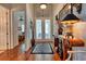 Elegant foyer with hardwood floors, decorative rug, and a stylish console table at 492 Grand Cypress Way, Murrells Inlet, SC 29576