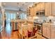 Well-appointed kitchen with stainless steel appliances, granite countertops, and ample cabinet space at 492 Grand Cypress Way, Murrells Inlet, SC 29576