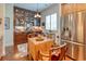 This kitchen features stainless steel appliances, custom cabinets, and an adjacent eat in table area at 492 Grand Cypress Way, Murrells Inlet, SC 29576