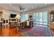 Bright living room with hardwood floors, fireplace, and sliding doors at 492 Grand Cypress Way, Murrells Inlet, SC 29576