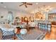 An open concept living room leads into the gourmet kitchen that features bar stool seating at 492 Grand Cypress Way, Murrells Inlet, SC 29576