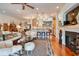 Open-concept living room with hardwood floors, kitchen access, and stylish decor at 492 Grand Cypress Way, Murrells Inlet, SC 29576