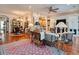 Open-concept living room with a fireplace, hardwood floors, and stylish furnishings at 492 Grand Cypress Way, Murrells Inlet, SC 29576