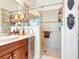 Modern bathroom featuring a glass enclosed shower with tiled walls and built-in shelving at 492 Grand Cypress Way, Murrells Inlet, SC 29576