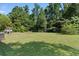 Large green backyard space with lots of trees for privacy and room to play at 5 Dogwood St., Hemingway, SC 29554