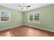 Bright bedroom features neutral walls, natural light, and hardwood floors at 5 Dogwood St., Hemingway, SC 29554
