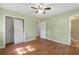 Bright bedroom boasts wood-look floors and neutral walls with access to a closet and bathroom at 5 Dogwood St., Hemingway, SC 29554