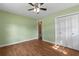 Bedroom features green walls, bi-fold closet and wood look floors at 5 Dogwood St., Hemingway, SC 29554