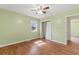 Neutral bedroom with wood-look floors and a window that lets in natural light at 5 Dogwood St., Hemingway, SC 29554