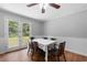 Classic dining room with table set for six, light gray walls and hardwood floors at 5 Dogwood St., Hemingway, SC 29554